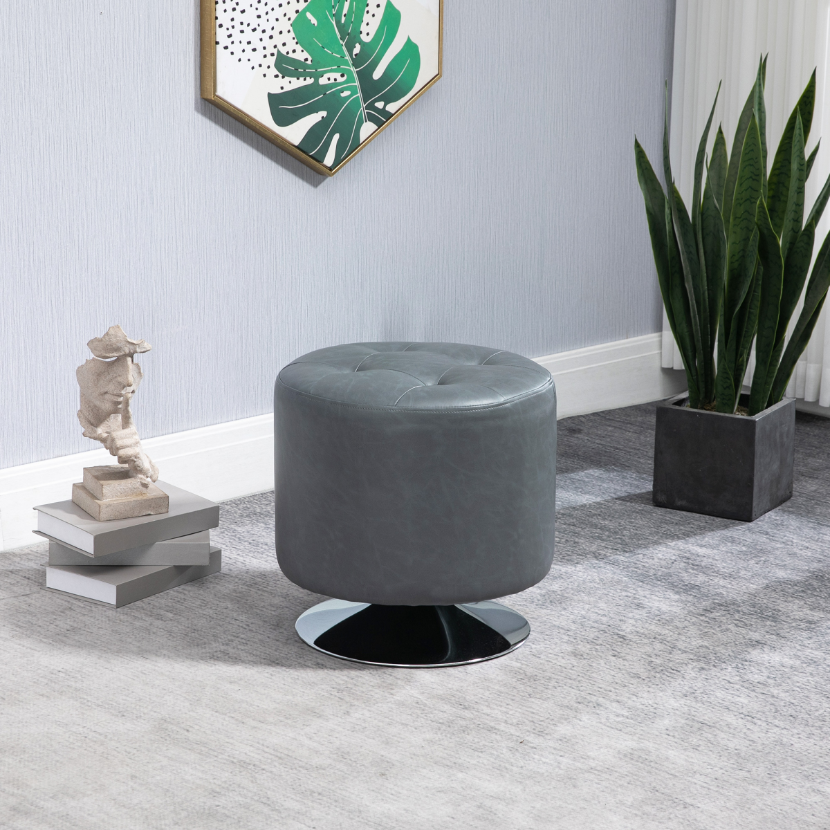 Grey 360‑degree swivel footstool with padded seat.