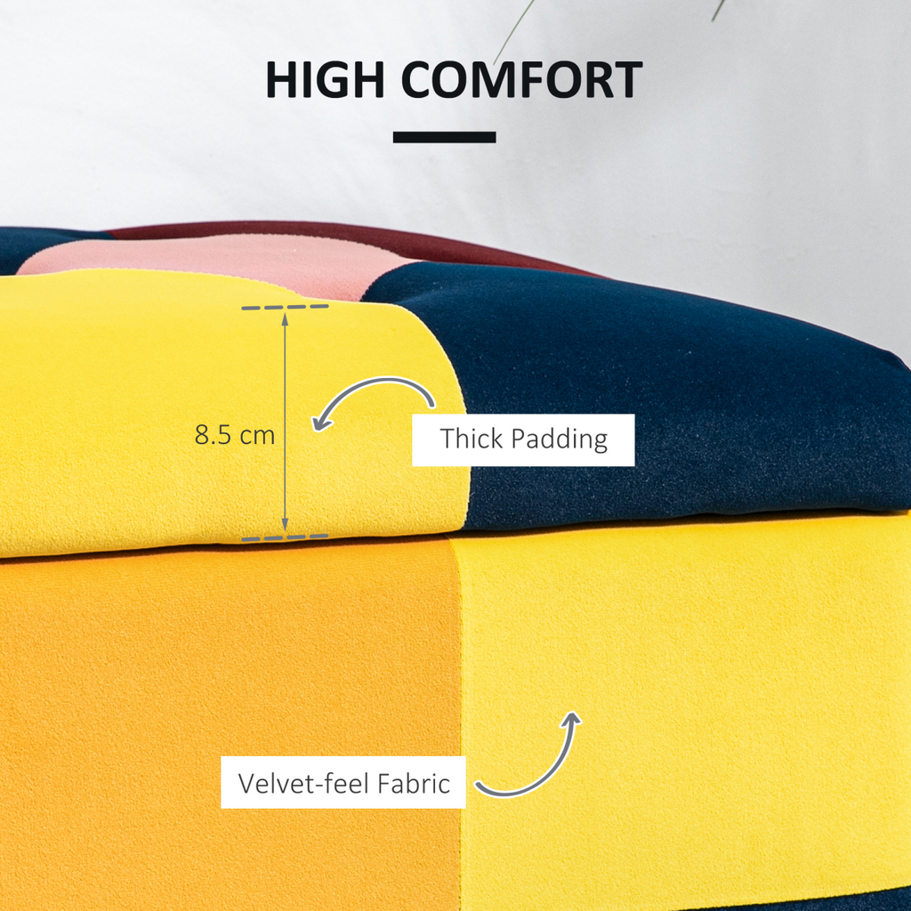 Colour‑block velvet storage ottoman with button‑tufted lid.