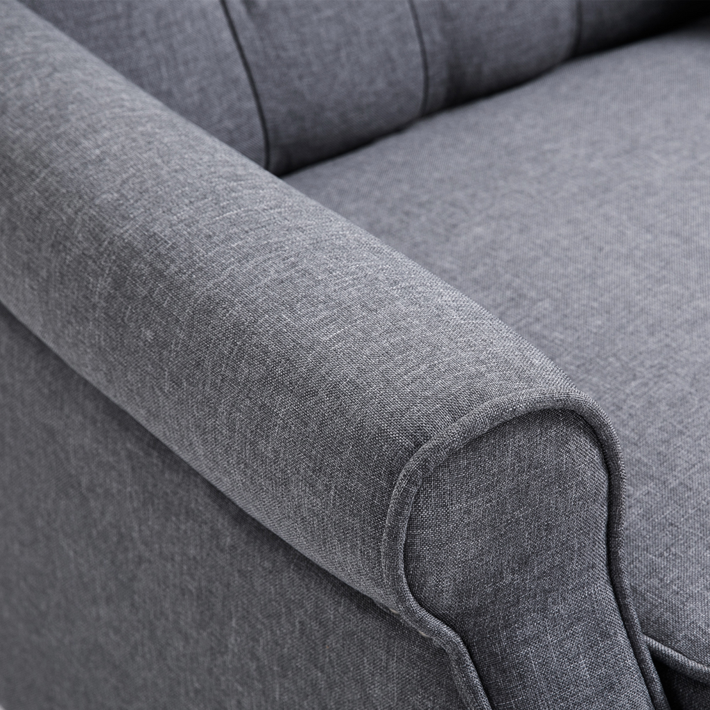 Light grey fabric recliner armchair with footrest.