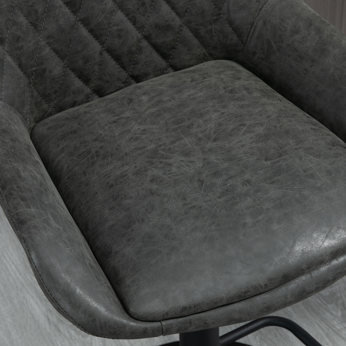 Set of two adjustable grey swivel bar stools with chrome base.