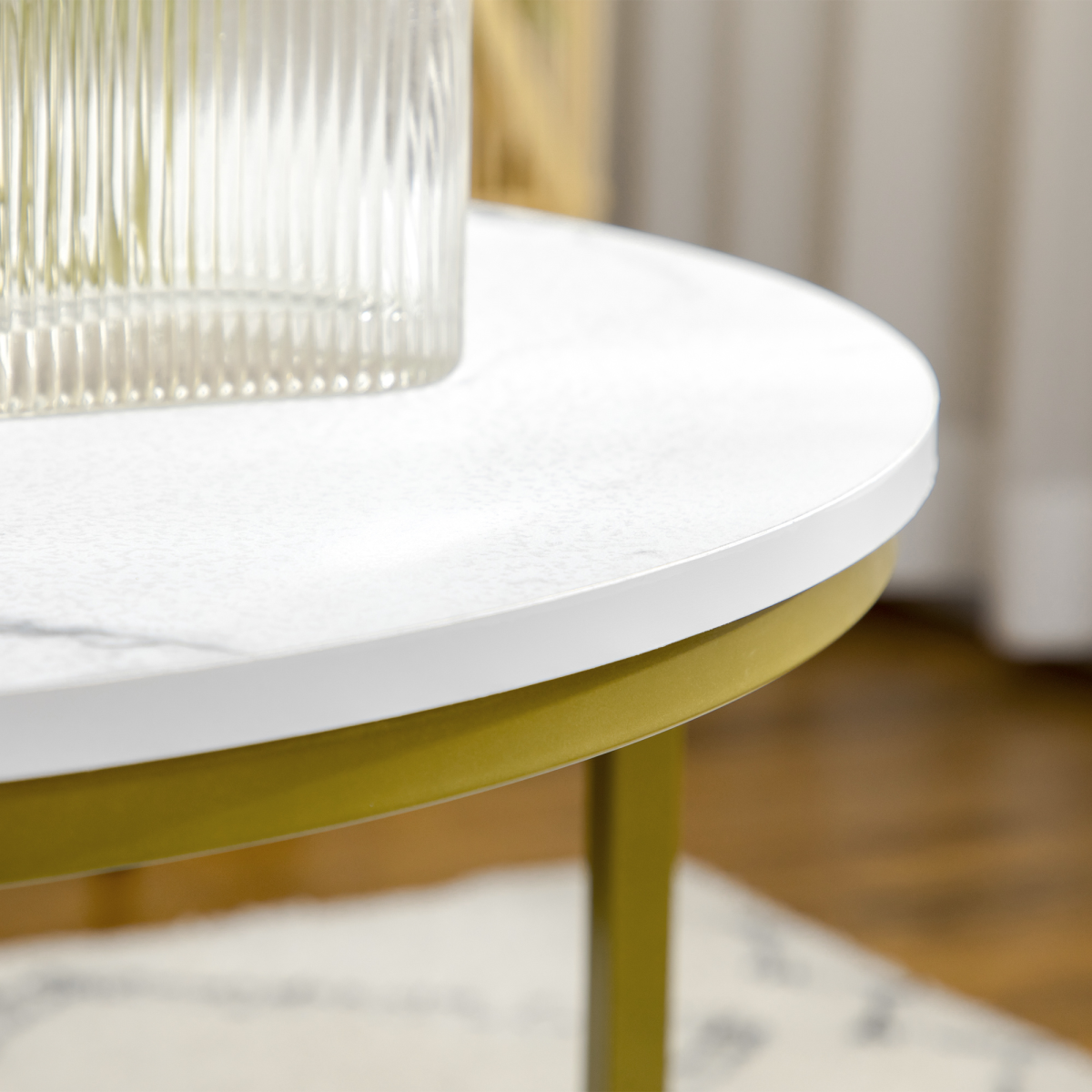 Set of two round marble‑effect nesting coffee tables.