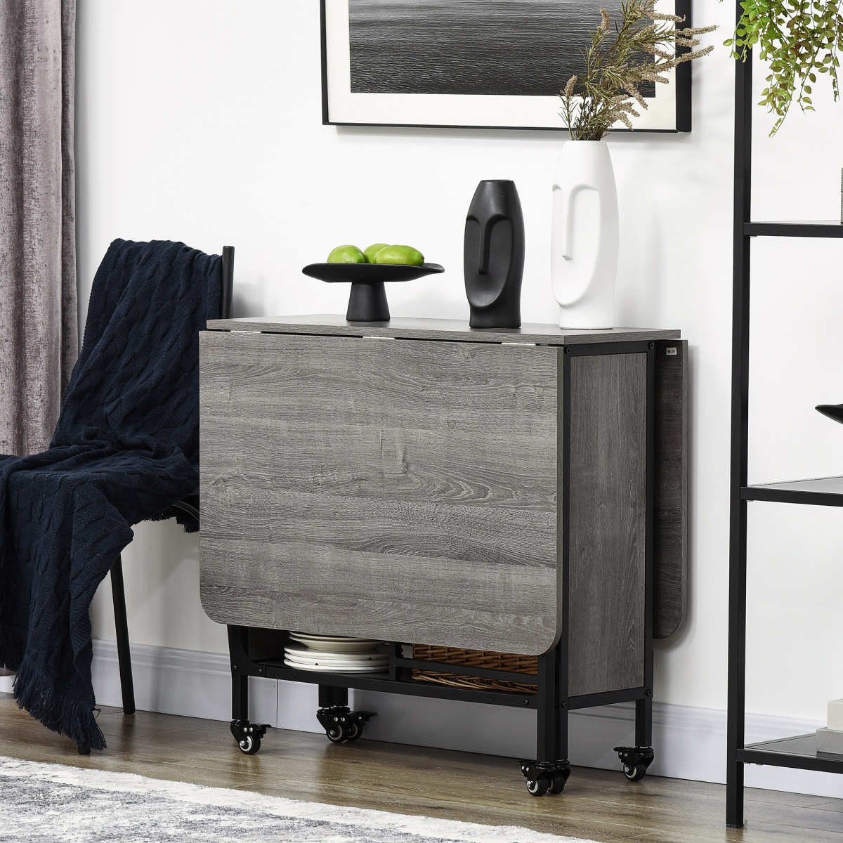 Mobile drop‑leaf folding kitchen table with storage shelves.