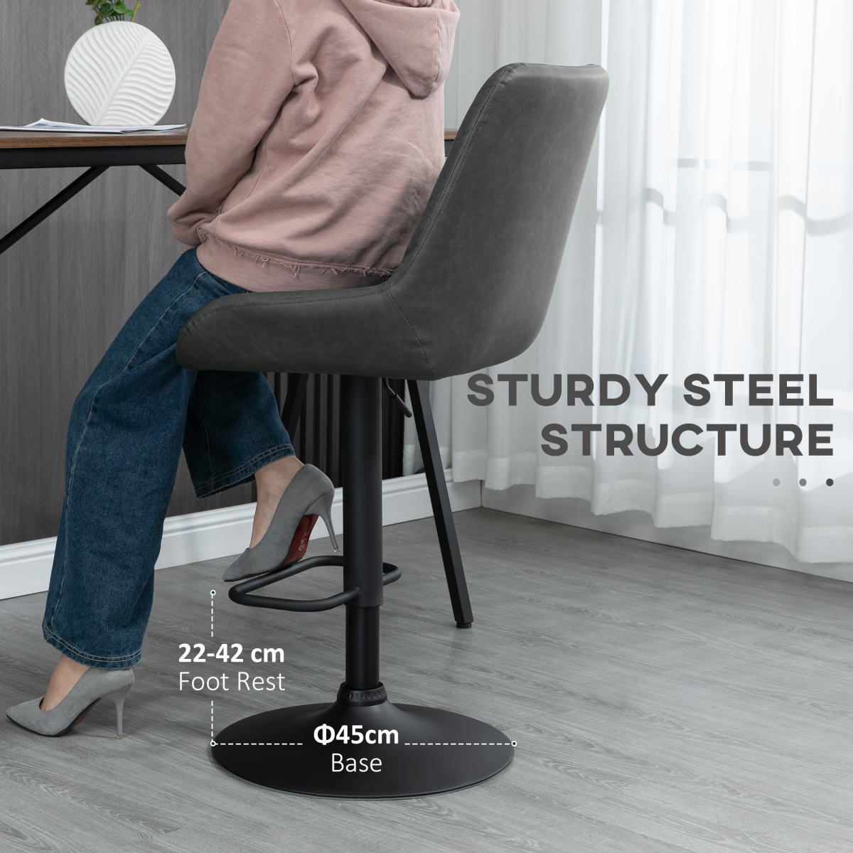 Set of two adjustable grey swivel bar stools with chrome base.
