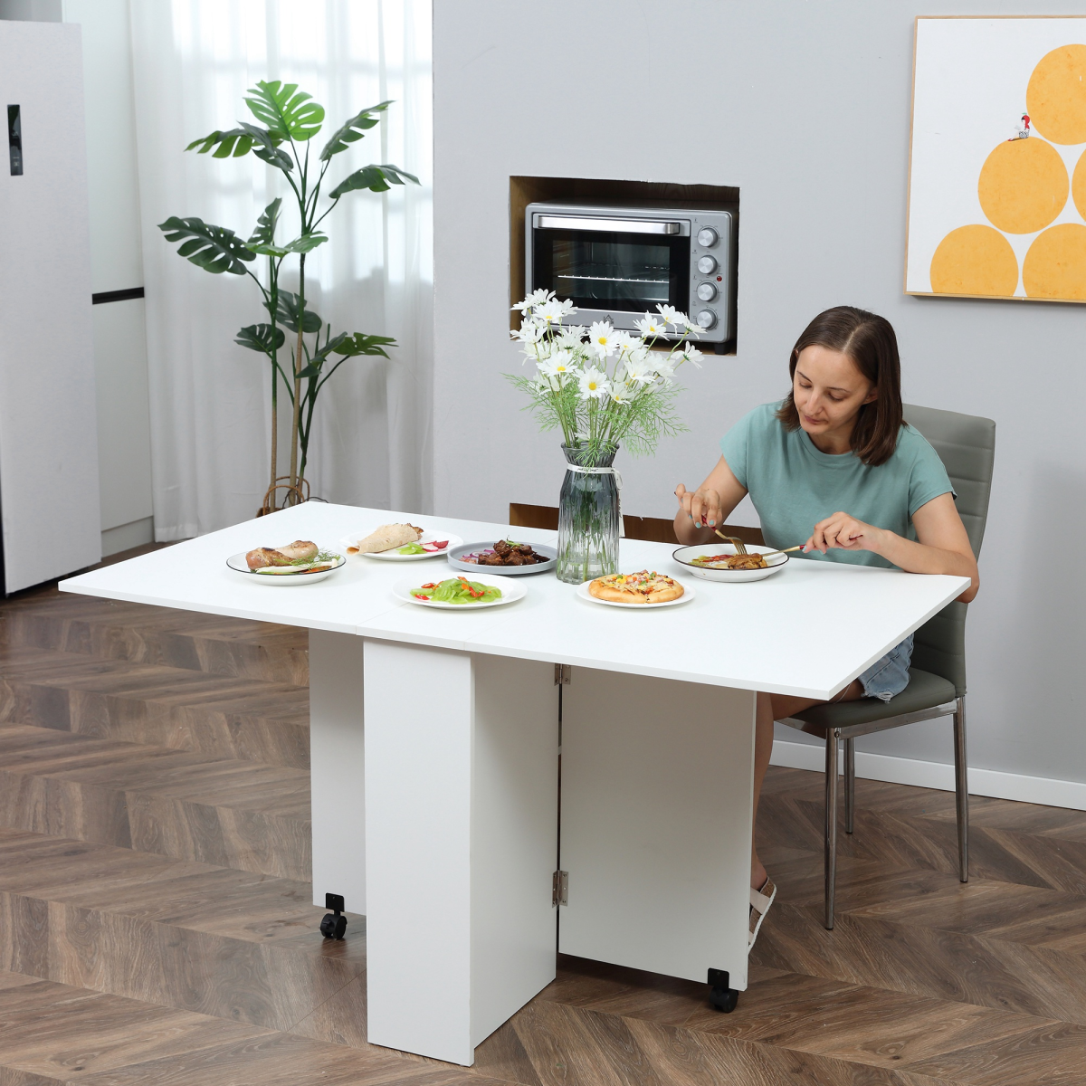 Mobile drop‑leaf kitchen table with shelves and wheels.