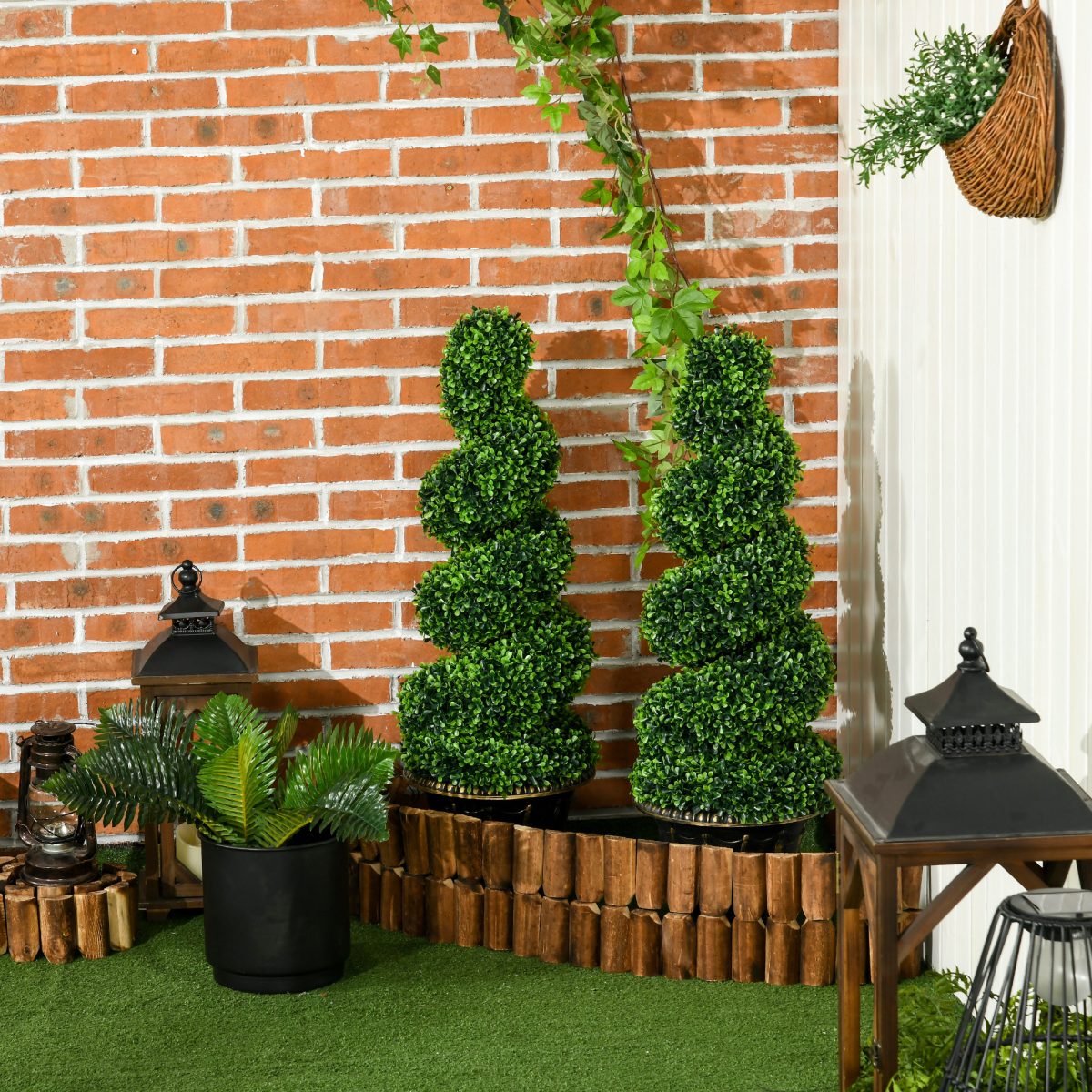 Set of two 90cm spiral boxwood topiary trees.
