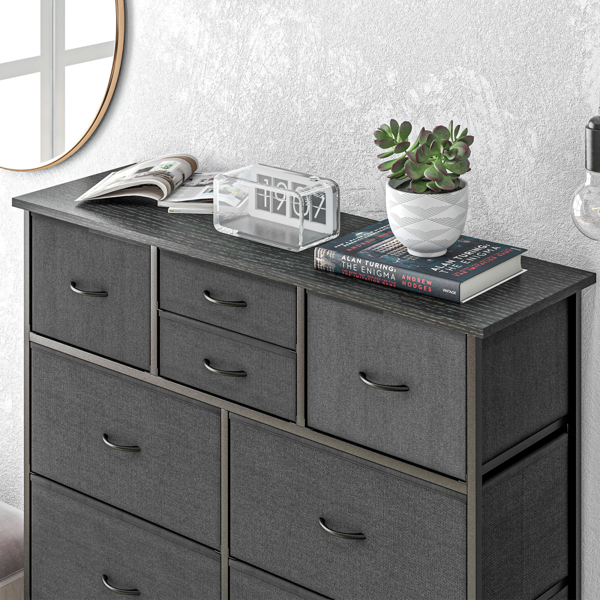 Black fabric chest of drawers with metal frame.
