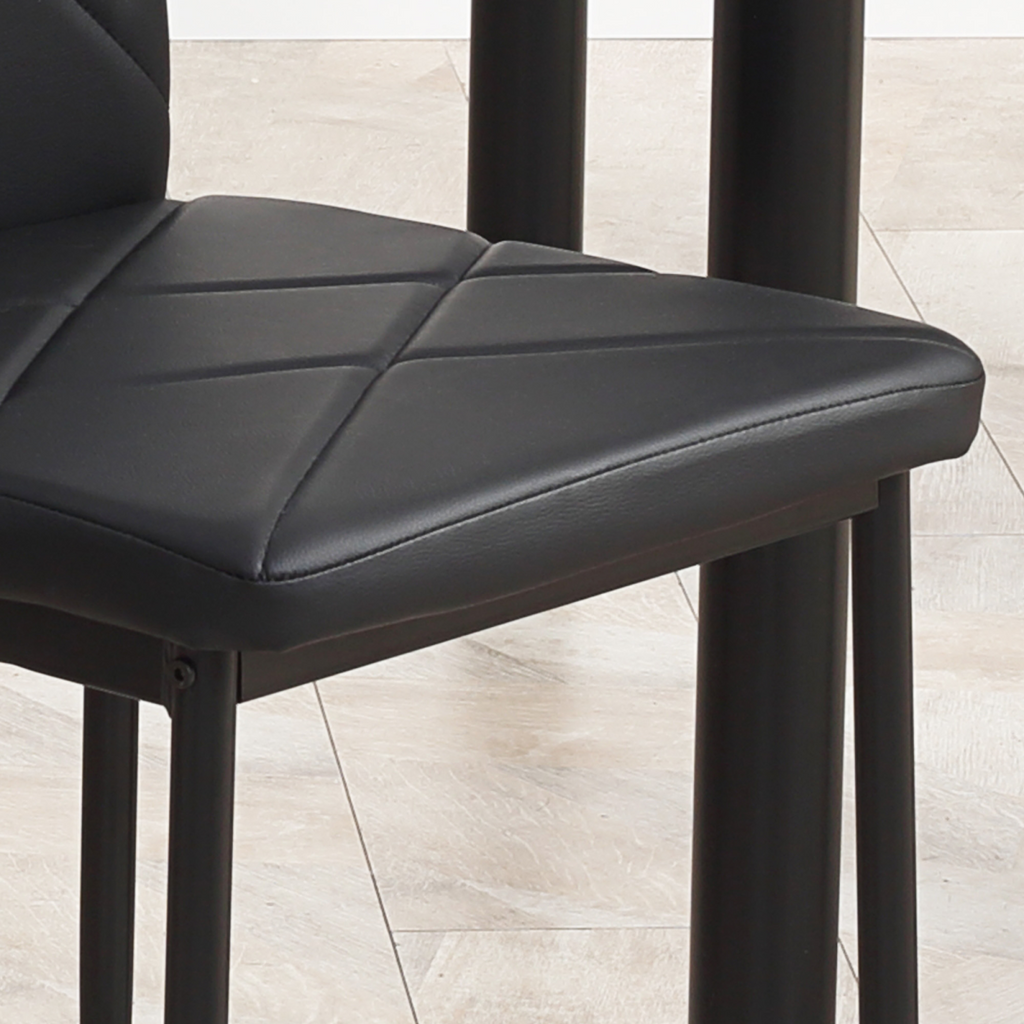 Modern dining table set for four with padded chairs.8.png