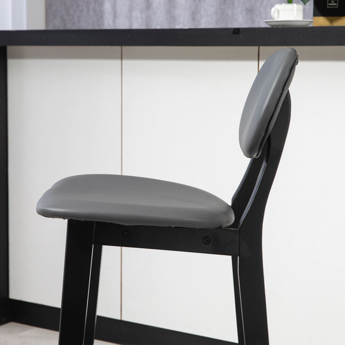 Set of two brown PU leather breakfast bar stools with wooden legs.8.png