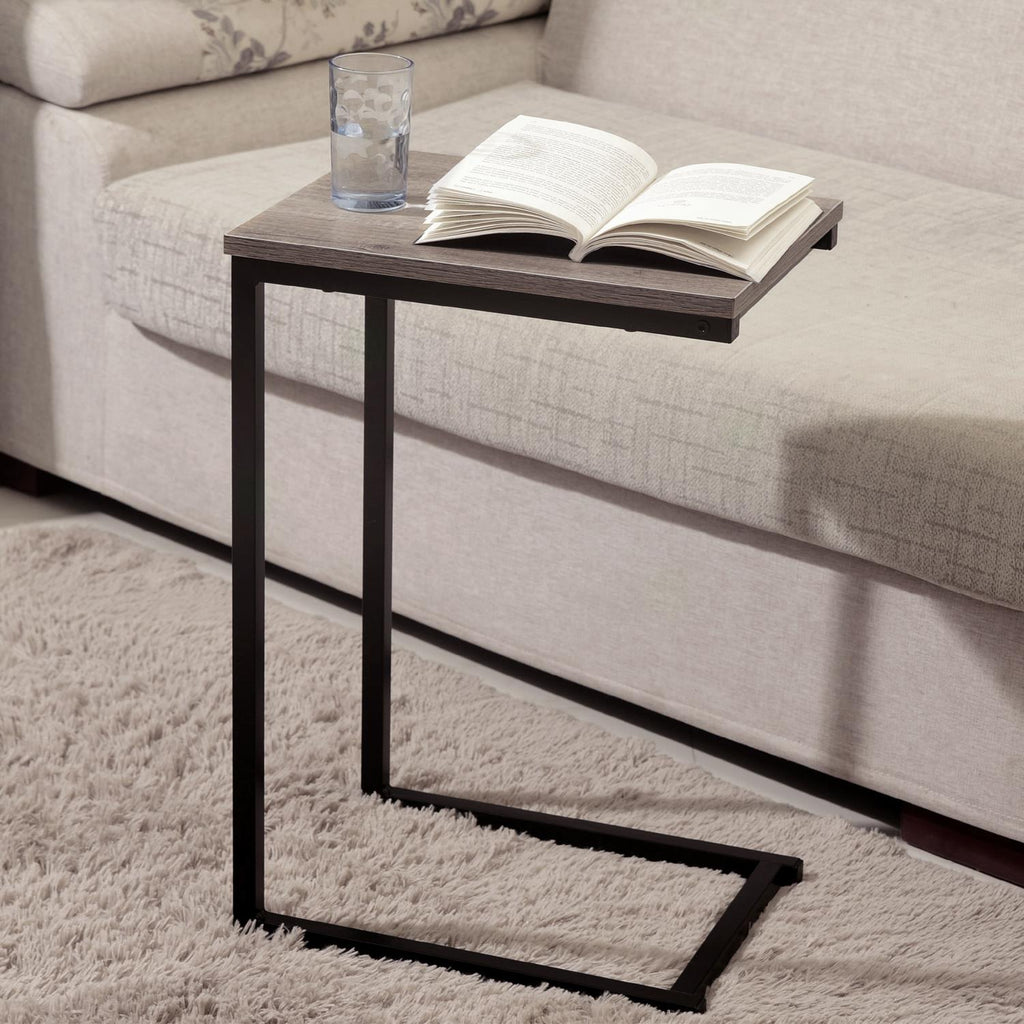Black C‑shaped slide‑under side table.
