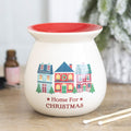 Cream ceramic wax melt burner printed with a row of little Christmas houses and a red dish on top