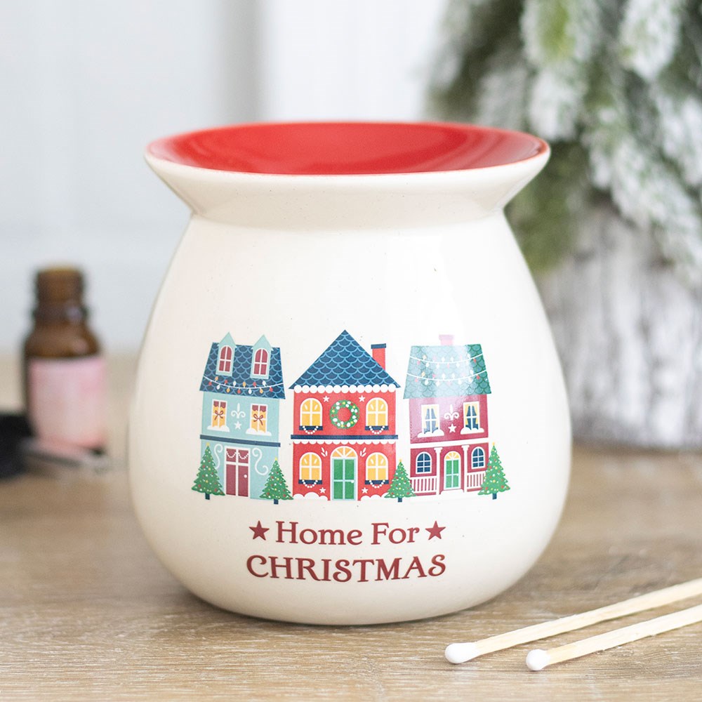 Cream ceramic wax melt burner printed with a row of little Christmas houses and a red dish on top